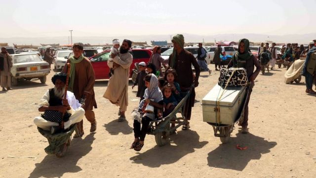 People cross the border into Afghanistan, at Chaman border, Pakistan, 20 August 2021.