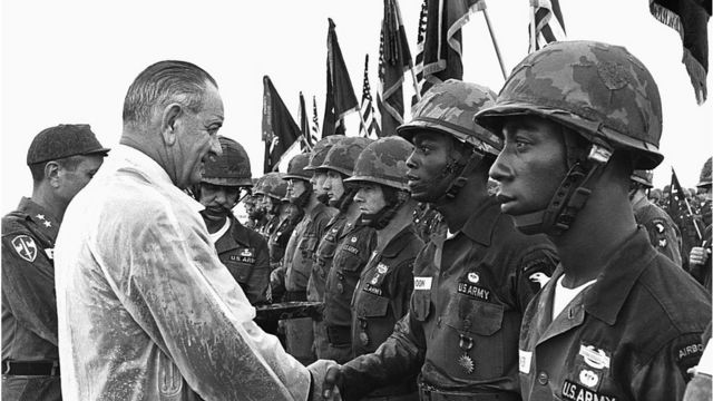 President Lyndon B Johnson shakes hands with troops