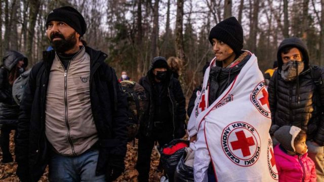 A Kurdish family from Dohuk in Iraq is assisted by activists from the NGO Grupa Granica (Border Group) on 9 November