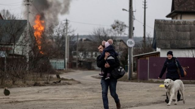 Residents in Irpin, near Kyiv, after shelling landed on an escape route on Sunday